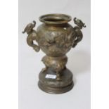 Late 19th Century Japanese bronze two handled vase, decorated in high relief with birds and foliage,