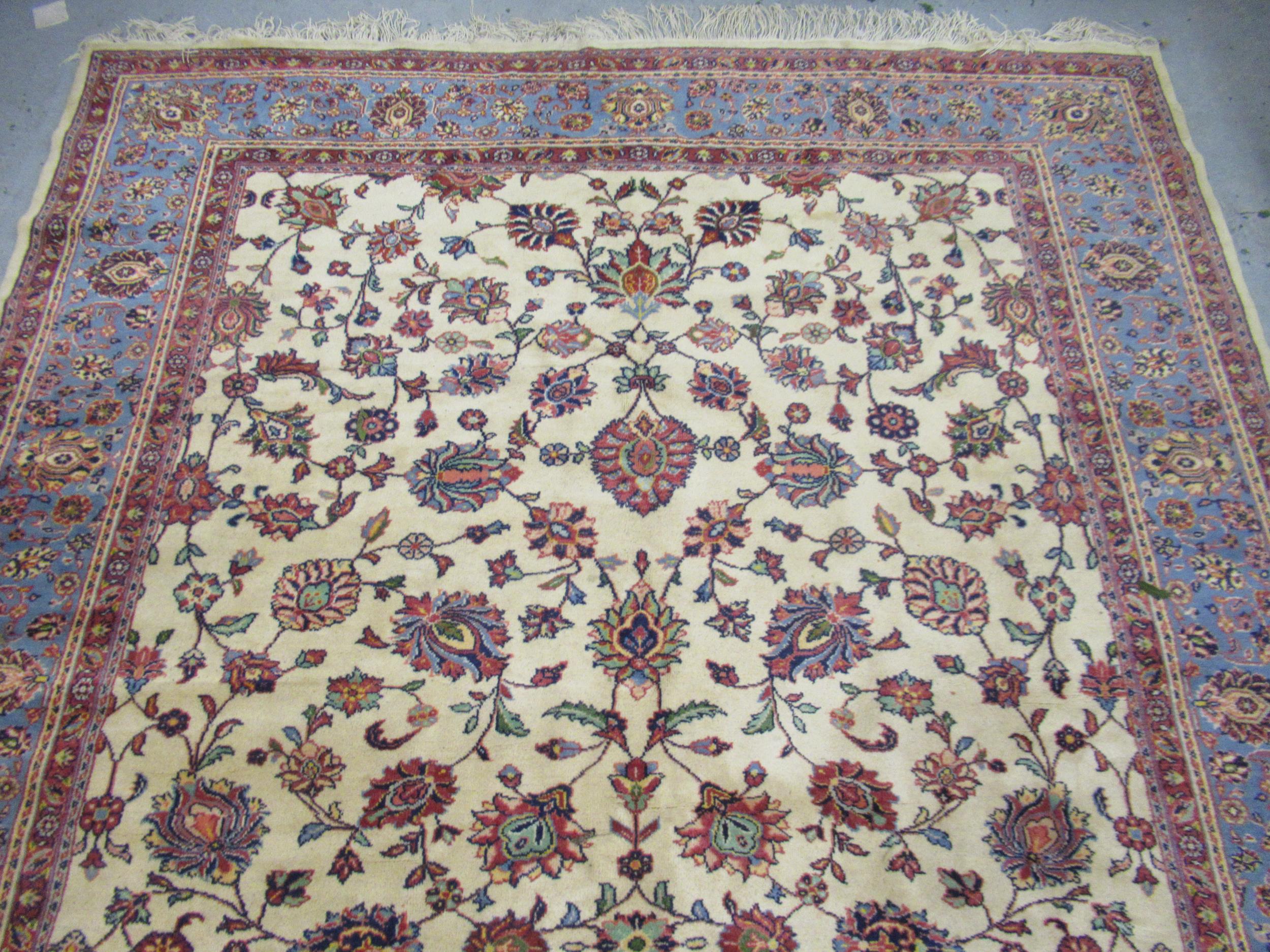 Indian carpet with an all over stylised floral design on ivory ground with pale blue borders, 140ins - Image 2 of 6