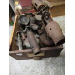Drawer containing a collection of various antique blow torches (at fault)