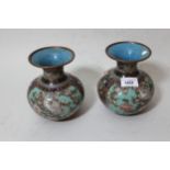 Pair of 20th Century Chinese cloisonne baluster form vases with bird and floral decoration,