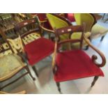 Pair of Regency mahogany open armchairs with rail backs, scroll arms, overstuffed seats and turned