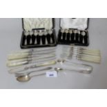 Two cased sets of six silver coffee spoons in fitted boxes, part set of eleven silver and mother