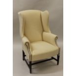 20th Century upholstered wingback armchair in Georgian style