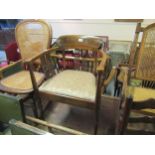 Edwardian mahogany and inlaid bow back open elbow chair with pierced splat back and sides, raised on