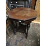 Late Victorian octagonal walnut two tier occasional table on eight turned supports
