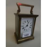 Small brass cased carriage clock, the enamel dial with Roman numerals and single train movement (