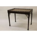 Good 19th Century mahogany silver table of Chippendale design, the rectangular galleried top above a