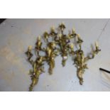 Set of four good quality ormolu rococo design three light wall sconces , each approximately 22ins