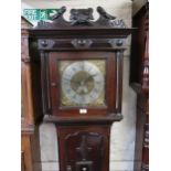 Unusual small oak longcase clock, the square hood with floral surmount and flanking pilasters