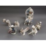 Lladro figure of a child seated on a chair, 10ins high approximately, in original box together