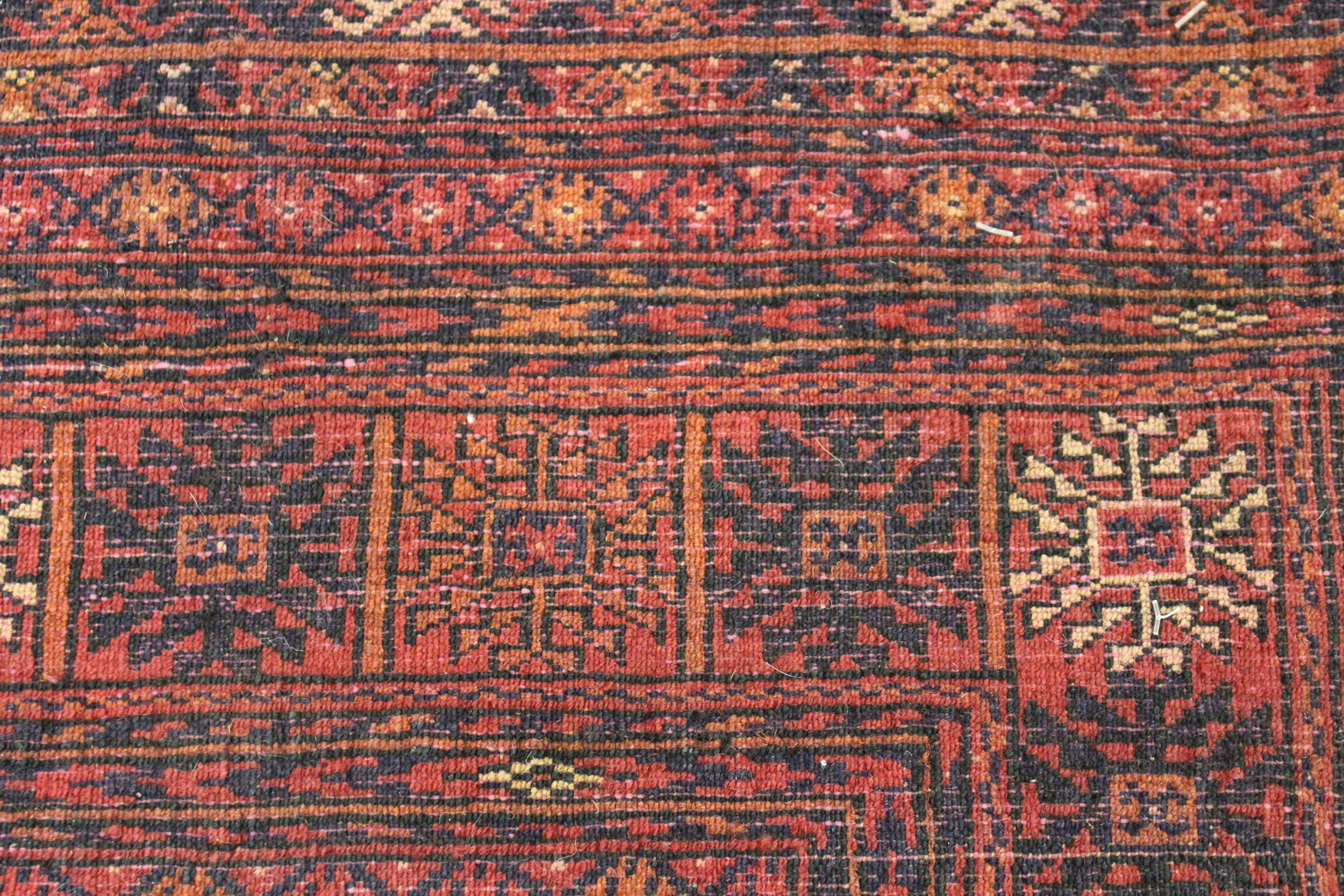 Modern Turkoman rug with three rows of ten gols on a wine ground, with multiple border, 6ft x 4ft - Image 4 of 4