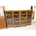 Late 19th / early 20th Century mahogany dwarf breakfront bookcase, the moulded top above four