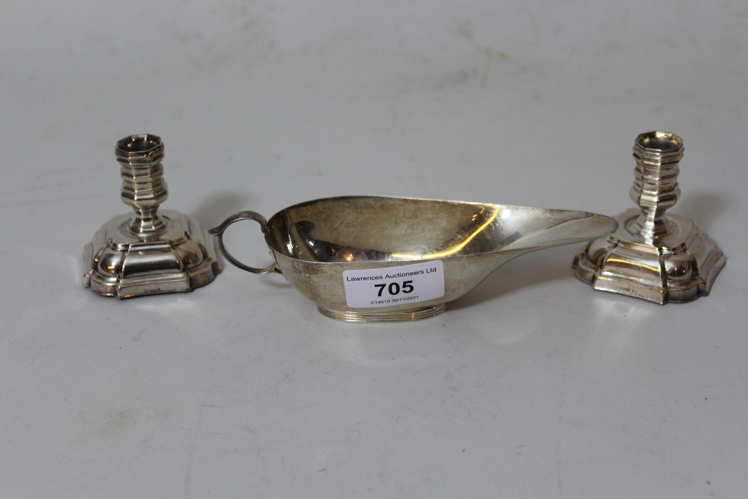 Small Birmingham silver sauce boat together with a pair of Danish silver plated dwarf candlesticks