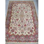 Sparta carpet with a medallion and all over stylised floral design on ivory ground with borders,