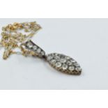 Fifteen stone old cut diamond set lozenge shaped pendant with diamond set loop, the lozenge