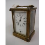 Late 19th / early 20th Century French gilt brass carriage clock, the enamel dial with Roman and