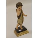 19th Century Italian carved and painted polychrome figure of a standing putto on a rectangular