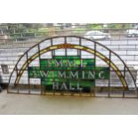 Large 1920's leaded coloured glass arch top overdoor panel, inscribed ' Small Swimming Hall ' (at