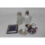 Two silver mounted cut glass sugar casters, small silver mounted photograph frame, silver tea