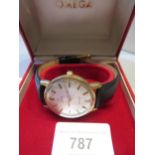 Gentleman's 9ct gold cased Omega Seamaster wristwatch, the champagne dial with baton numerals and