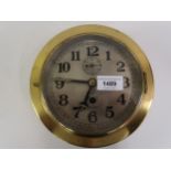 20th Century Seikosha ship's circular brass bulkhead clock, the silvered dial with Arabic numerals