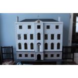 Large modern dolls house, modelled on the Queen Mary dolls house, with ten rooms, flanking a central
