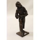Eutrope Bouret, dark patinated bronze figure of Pierrot playing a mandolin, on a square plinth base,