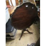 19th Century circular mahogany pedestal table with shaped dish top, on cabriole carved supports, (at