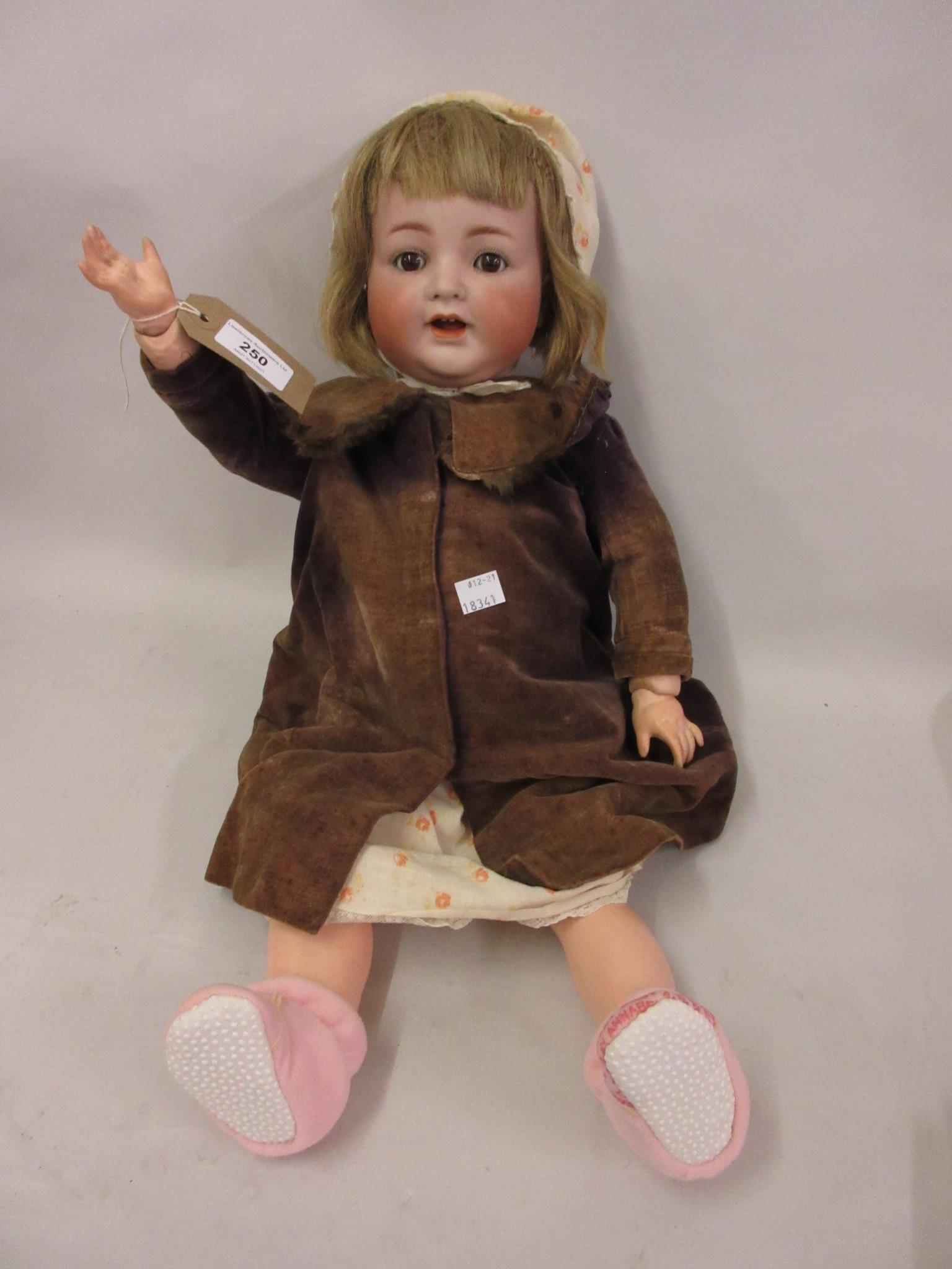 Simon & Halbig, German bisque headed doll with sleeping eyes, open mouth and two teeth on a