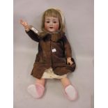 Simon & Halbig, German bisque headed doll with sleeping eyes, open mouth and two teeth on a