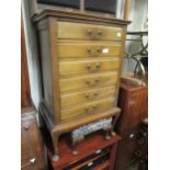 Early 20th Century mahogany six drawer music cabinet with brass handles and cabriole supports, 21ins