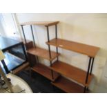 Mid 20th Century teak and ebonised wooden shelving system of six open shelves, raised on turned