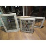 Pair of 1930's pine framed leaded and coloured glass window panels (with damages), 13ins x 17ins,