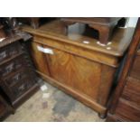 Victorian mahogany side cabinet, the moulded top above two doors and a plinth base, raised on low