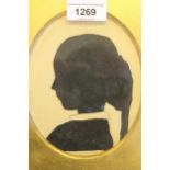 19th Century oval mounted silhouette portrait of a girl, in gilt and ebonised frame, 5.5ins x 4.