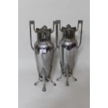 Pair of WMF silvered metal two handled vases, the pierced rims above ovoid bodies with stylised