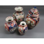 Imari baluster form vase and cover, 14.5ins high together with a graduated group of three similar