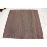 Flat woven coir rug, 7ft square approximately together with a dark brown sheepskin rug and a Chinese