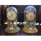 Edwardian brass anniversary clock under glass dome and another later anniversary clock, (at fault)