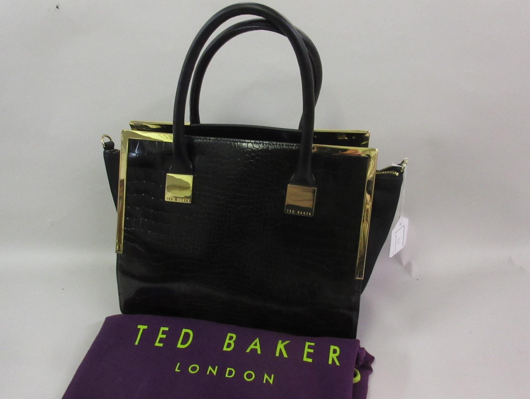 Ted Baker, gilt brass mounted black leather handbag, with dust bag This bag has been used but is