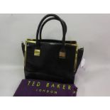 Ted Baker, gilt brass mounted black leather handbag, with dust bag This bag has been used but is