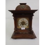20th Century oak bracket clock, the brass dial, with silvered chapter ring, Roman numerals and two