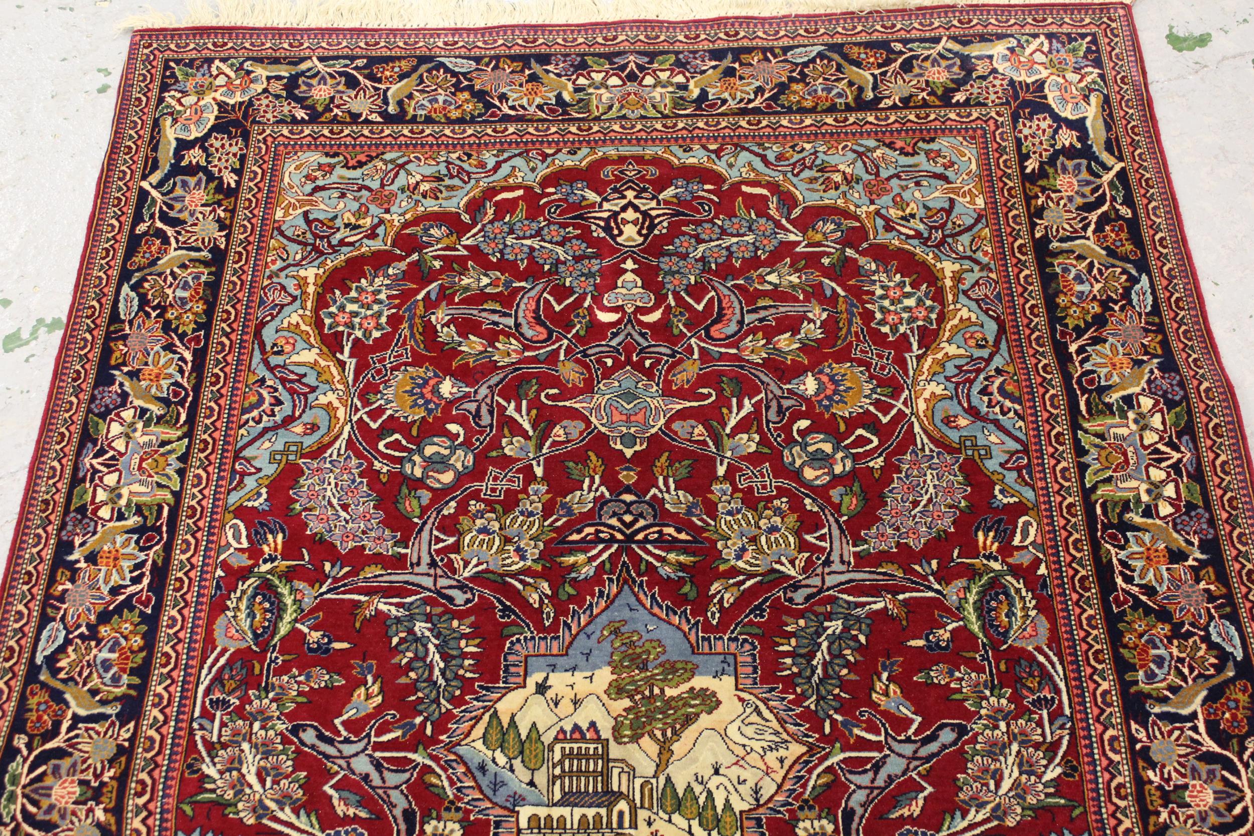 Qum rug with a pictorial centre medallion and all over stylised floral design on wine red ground - Image 2 of 4