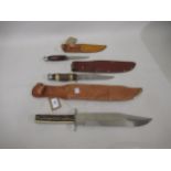 Bowie knife with simulated horn grip and leather sheath and two smaller earlier Bowie knives in