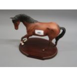 Royal Doulton bisque figure of a horse, on an oval wooden base
