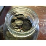 Glass jar containing a collection of various pre-decimal and World coinage