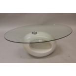 20th Century oval glass and composite pebble form coffee table, 43ins x 23.5ins x 15.5ins high