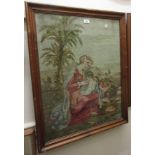 19th Century woolwork, a mother and child in a landscape, 27ins x 22ins