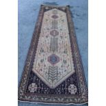 Abadeh runner with a medallion and all-over design on a blue ground with borders, 3.1m x 95cms