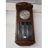 Early 20th Century Continental two train wall clock with silvered dial and Arabic numerals above a